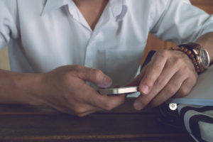 businessman using a mobile phone with texting message on app smartphone