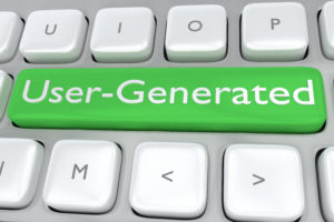 Render illustration of computer keyboard with the print User-Generated Content on a green button